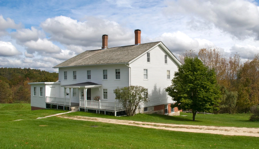 white house with wide lawn